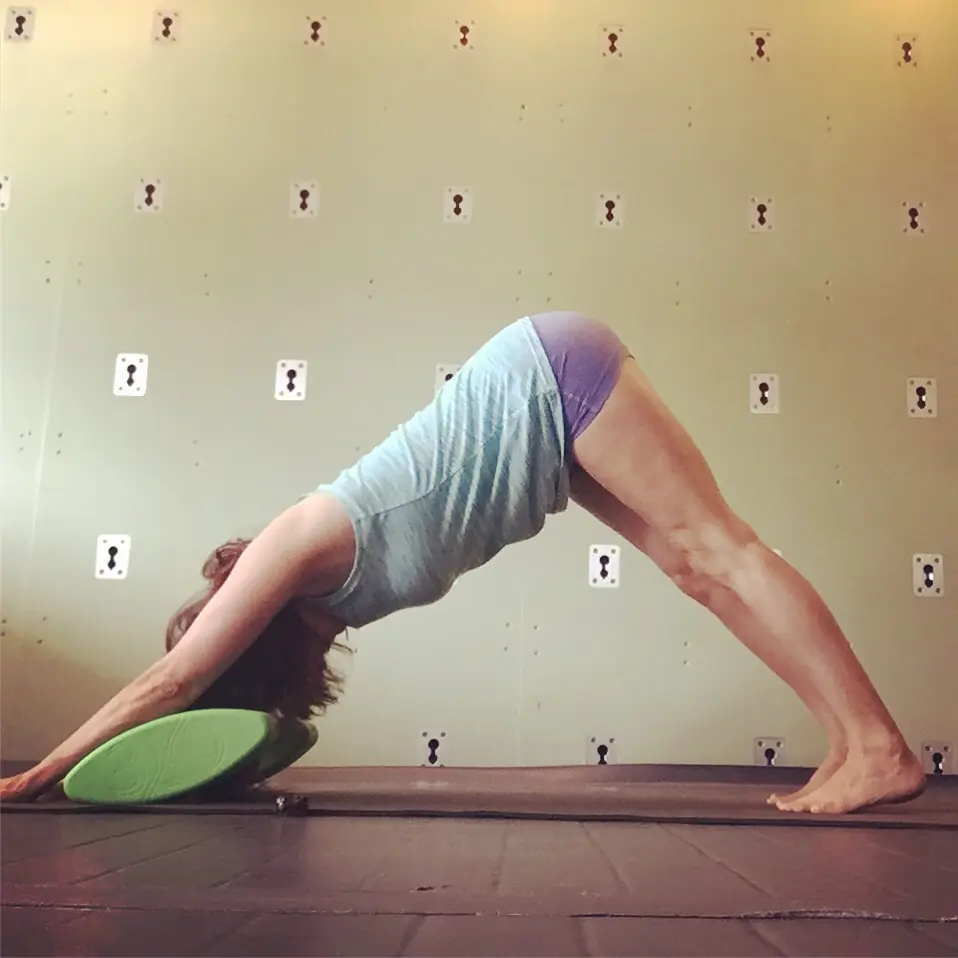 Downward-facing dog with a block supporting the head